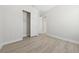 A neutral bedroom offers a closet, modern floors, and white trim at 2120 Antilles Club Dr # 10, Kissimmee, FL 34747