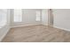 Bright bedroom with natural light, light gray walls, and light vinyl plank flooring at 2120 Antilles Club Dr # 10, Kissimmee, FL 34747