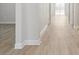 Bright hallway with wood-look floors and white trim at 2120 Antilles Club Dr # 10, Kissimmee, FL 34747