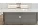Close-up of the kitchen island with a white countertop, stainless steel sink, and light gray base at 2120 Antilles Club Dr # 10, Kissimmee, FL 34747