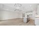 Spacious living area with a kitchen island, recessed lighting, and wood-look flooring at 2120 Antilles Club Dr # 10, Kissimmee, FL 34747