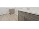 Close-up of a utility sink with gray shaker cabinets and white countertop at 2120 Antilles Club Dr # 10, Kissimmee, FL 34747