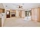 Carpeted living room featuring a brick fireplace and large sliding glass doors to the backyard at 2450 Nela Ave, Belle Isle, FL 32809