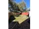 Fenced in back yard with grass, mature trees, and plenty of room for activities at 2652 Graduate Ct, Orlando, FL 32826