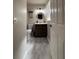 Updated bathroom with marble flooring, modern vanity, and stylish fixtures at 2652 Graduate Ct, Orlando, FL 32826