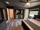 Modern main bedroom boasts hardwood floors, ceiling fan, walk-in closet, and natural light from the windows at 2652 Graduate Ct, Orlando, FL 32826