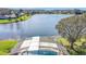 Pool backyard of a home with a lake view at 2732 Lone Feather Dr, Orlando, FL 32837