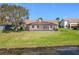 Home's screened pool and manicured backyard offers a private outdoor retreat with space to unwind at 2732 Lone Feather Dr, Orlando, FL 32837