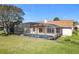 Lush backyard offers a screened pool, creating a private oasis for outdoor living and enjoyment at 2732 Lone Feather Dr, Orlando, FL 32837