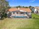 Backyard view features a screened pool and well maintained lawn, blending outdoor living and relaxation at 2732 Lone Feather Dr, Orlando, FL 32837