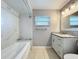 Updated bathroom with marble countertop, a shower with stone seat and shelving, and ample lighting at 2732 Lone Feather Dr, Orlando, FL 32837