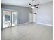 Bedroom with tile flooring, a ceiling fan, a door to the patio, and neutral paint tones at 2732 Lone Feather Dr, Orlando, FL 32837