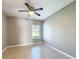 The bedroom features a ceiling fan, neutral walls, tile flooring, and a window at 2732 Lone Feather Dr, Orlando, FL 32837