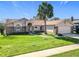 Inviting home exterior with a lush lawn, walkway, and a two-car garage, showcasing curb appeal at 2732 Lone Feather Dr, Orlando, FL 32837