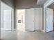 View of the hallway showing access to the living room with fireplace and other rooms at 2732 Lone Feather Dr, Orlando, FL 32837