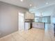 Updated kitchen featuring white cabinets, stainless steel appliances and tiled floors at 2732 Lone Feather Dr, Orlando, FL 32837
