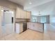 Well-lit kitchen showcases granite countertops and island with sink and modern stainless steel dishwasher at 2732 Lone Feather Dr, Orlando, FL 32837