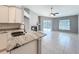 This stylish kitchen leads into the living room with views to the pool and backyard at 2732 Lone Feather Dr, Orlando, FL 32837