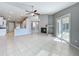 Living room with fireplace, tile floor, and view to the kitchen and screened-in porch at 2732 Lone Feather Dr, Orlando, FL 32837