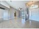 Spacious living room with tile flooring, high ceilings, and a chandelier, creating an airy atmosphere at 2732 Lone Feather Dr, Orlando, FL 32837