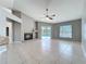 Spacious living room with a fireplace and access to the pool area through sliding glass doors at 2732 Lone Feather Dr, Orlando, FL 32837