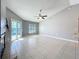 Bright living room features a ceiling fan and sliding door access to the pool at 2732 Lone Feather Dr, Orlando, FL 32837