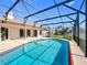 Enclosed pool area with screened enclosure, pool, and outdoor space for relaxation at 2732 Lone Feather Dr, Orlando, FL 32837