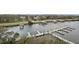 Scenic aerial view of waterfront property with docks and lush greenery at 3 Riverwalk Dr # 506, New Smyrna Beach, FL 32169