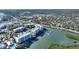 Aerial view of waterfront condominium complex with docks and surrounding area at 3 Riverwalk Dr # 506, New Smyrna Beach, FL 32169