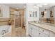 Elegant bathroom featuring a soaking tub, glass-enclosed shower, and granite countertops at 3 Riverwalk Dr # 506, New Smyrna Beach, FL 32169