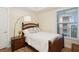 Cozy bedroom with comfortable bed, wood floors, and natural light, perfect for relaxation and restful sleep at 3 Riverwalk Dr # 506, New Smyrna Beach, FL 32169