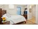 Comfortable bedroom with soft bedding, wood floors, and ample natural light, creating a relaxing retreat at 3 Riverwalk Dr # 506, New Smyrna Beach, FL 32169