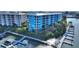 Condo building exterior with private balconies overlooking marina with boats at 3 Riverwalk Dr # 506, New Smyrna Beach, FL 32169