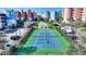 Tennis court with green and blue surface with ample lighting at 3 Riverwalk Dr # 506, New Smyrna Beach, FL 32169