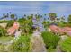 Expansive waterfront property featuring meticulously landscaped grounds and stunning lake views at 303 Waterwood Dr, Yalaha, FL 34797