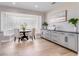 Bright breakfast nook with unique glass block window and an adjacent serving counter at 303 Waterwood Dr, Yalaha, FL 34797