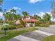 Charming community clubhouse, set among lush gardens with a convenient circular drive at 303 Waterwood Dr, Yalaha, FL 34797