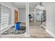 Grand foyer with a rock garden feature, soaring ceilings, and a staircase to the second floor at 303 Waterwood Dr, Yalaha, FL 34797