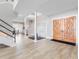 Foyer with modern staircase, double door entry and modern flooring at 303 Waterwood Dr, Yalaha, FL 34797