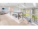 Spacious great room overlooking with high ceilings, large windows, and open floor plan at 303 Waterwood Dr, Yalaha, FL 34797