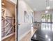 Kitchen area with modern cabinetry, under stair wine storage, granite countertop, and a view at 303 Waterwood Dr, Yalaha, FL 34797