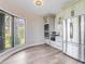 Kitchen nook featuring modern appliances, sleek cabinetry, and a bay window offering backyard views at 303 Waterwood Dr, Yalaha, FL 34797