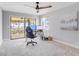 Office features water view, ceiling fan, modern desk, and a contemporary decorative art piece at 303 Waterwood Dr, Yalaha, FL 34797