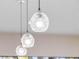 Unique kitchen pendant lighting fixtures featuring artistic glass design and bright illumination at 303 Waterwood Dr, Yalaha, FL 34797