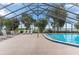 Relaxing screened pool area with lake views and comfortable lounge seating at 303 Waterwood Dr, Yalaha, FL 34797