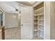 Charming kitchen pantry with multiple shelves and a neutral color palette at 3047 Riverbrook Dr, Winter Park, FL 32792