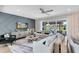 Spacious living room with a sliding glass door to the backyard and a modern accent wall at 3110 Norcott Dr, Davenport, FL 33837