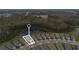 Aerial view of a neighborhood near a pond and forest, highlighting the home's scenic location at 3412 Yellowtop Loop, Clermont, FL 34714