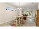 Cozy dining area with large windows providing natural light at 3412 Yellowtop Loop, Clermont, FL 34714