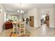 Open dining area with a view of the living room at 3412 Yellowtop Loop, Clermont, FL 34714
